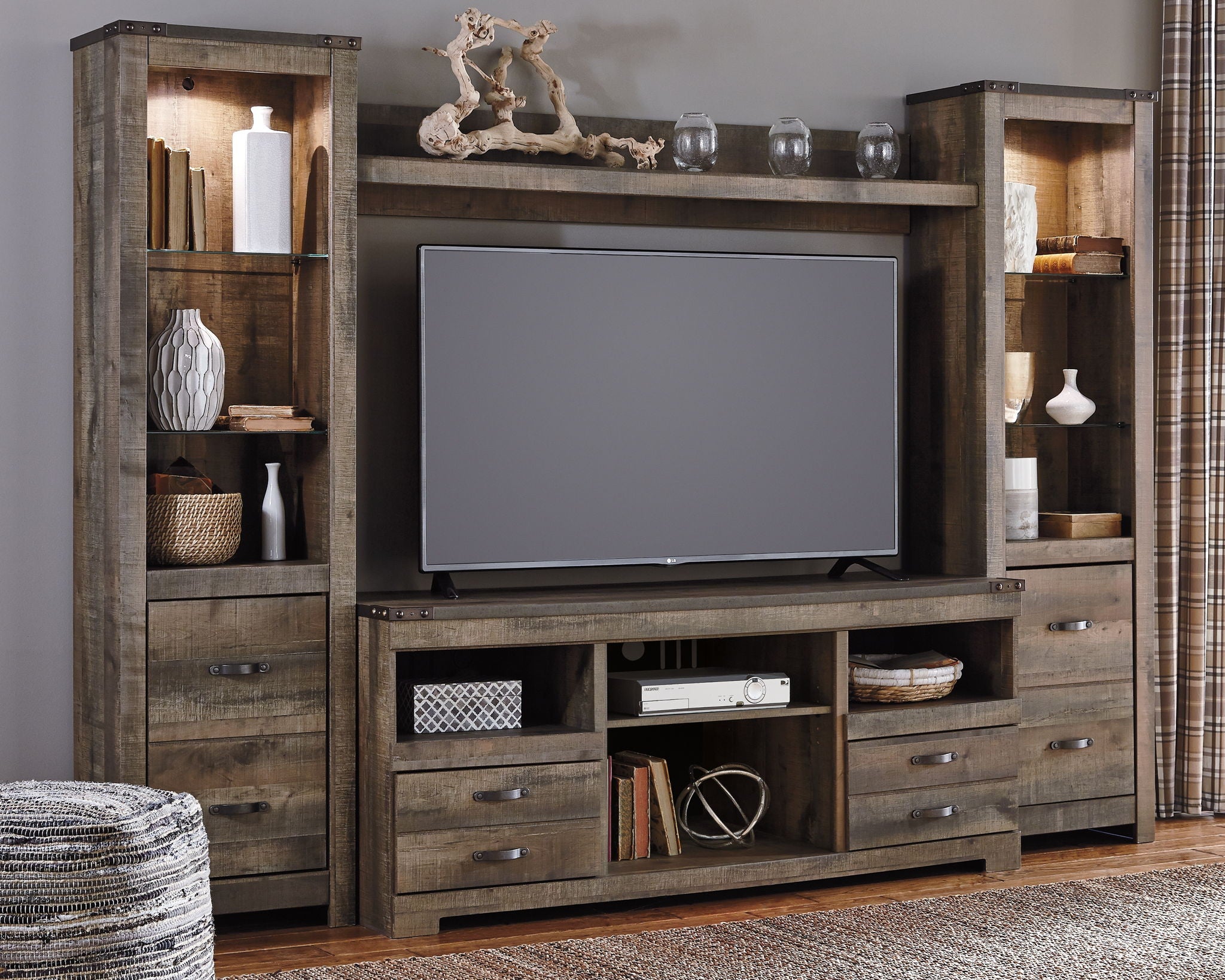 Trinell - 4 Pc. - Entertainment Center - 63" TV Stand - Brown