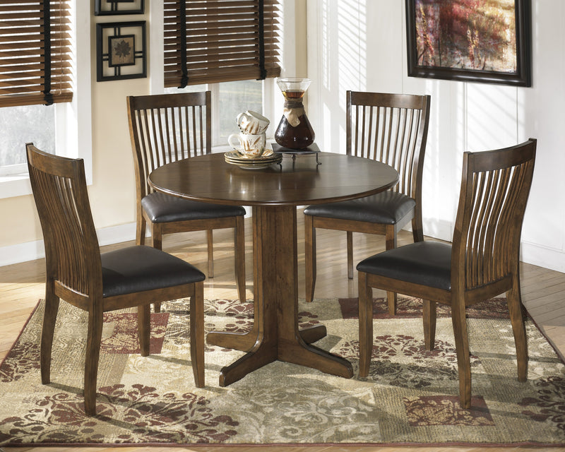 Stuman Table + Four FREE Chairs - Ashley shop at  Regency Furniture